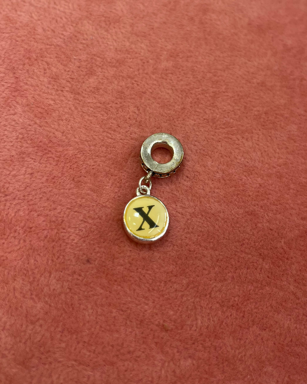 X Initial Charm